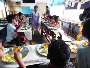 11 children eating at tables