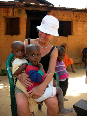 Edie holding village children 