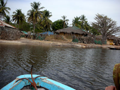 Approaching a traditional village in our pirogue