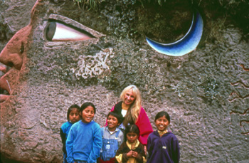 banner_world_wheel_sculpture_with_peguche_children_-_equcador